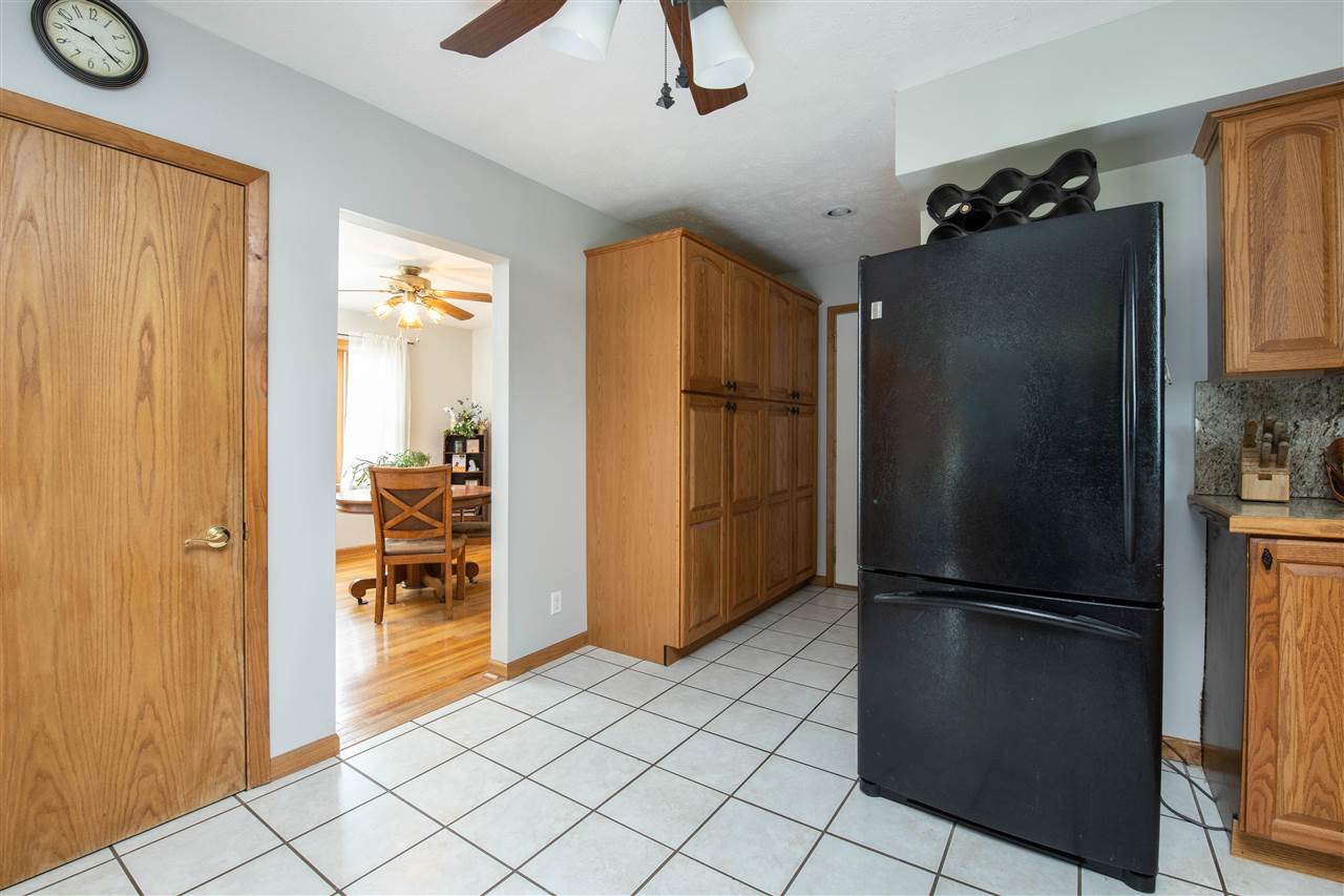8488 Grange Hall Road Garden Prairie, IL 61038 - Photo 12 of 35 a kitchen with a refrigerator and a stove
