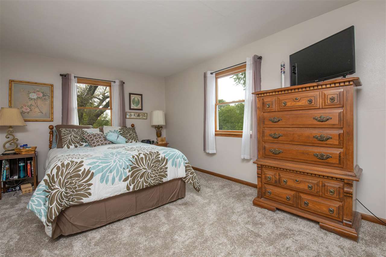 8488 Grange Hall Road Garden Prairie, IL 61038 - Photo 14 of 35 a bedroom with a bed and a television