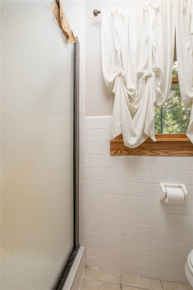 8488 Grange Hall Road Garden Prairie, IL 61038 - Photo 17 of 35 a bathroom with a sink and mirror