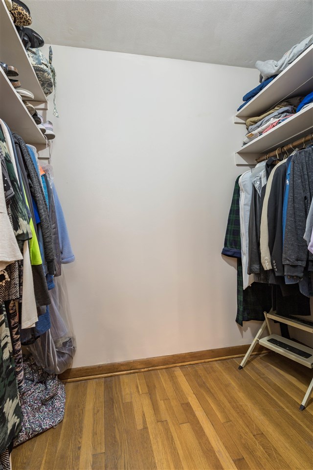 8488 Grange Hall Road Garden Prairie, IL 61038 - Photo 18 of 35 a view of walk in closet with clothes and shoes