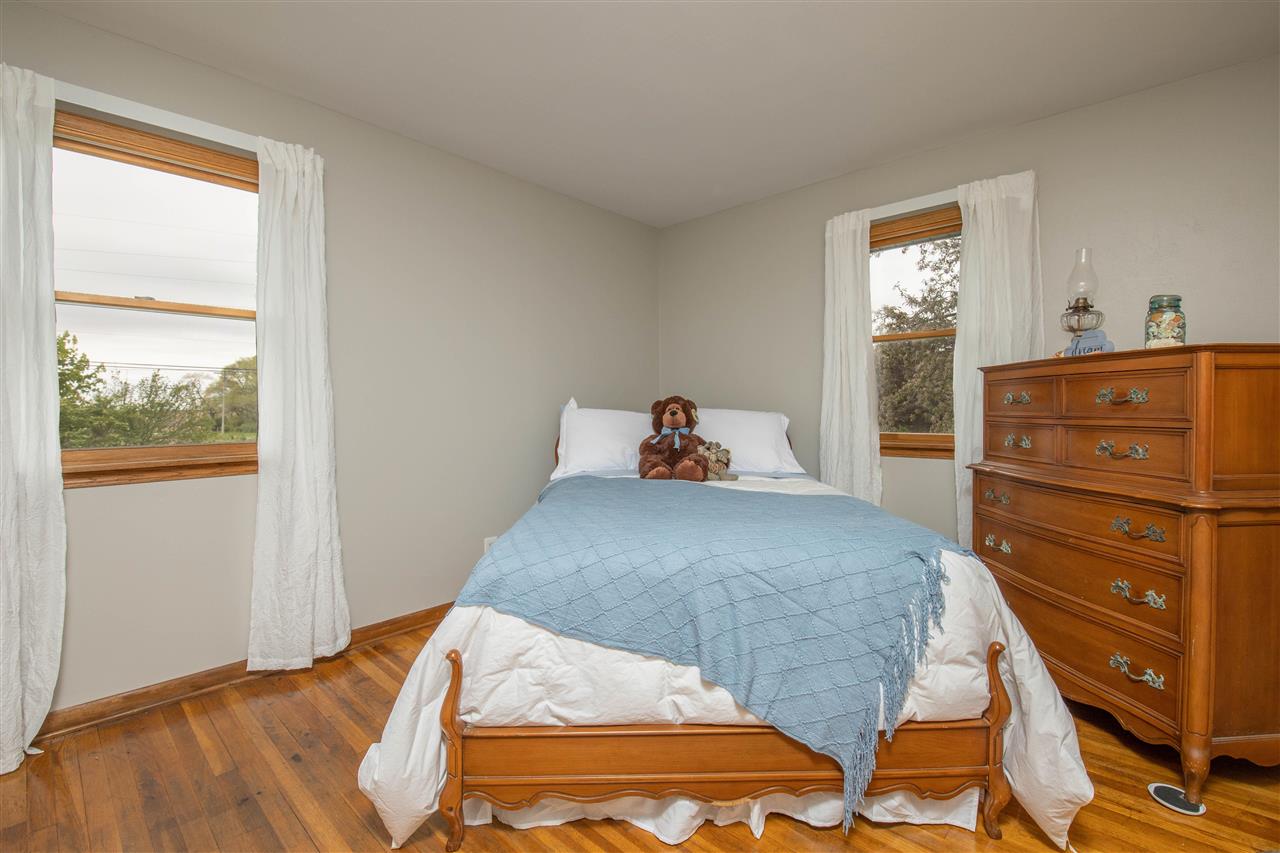 8488 Grange Hall Road Garden Prairie, IL 61038 - Photo 19 of 35 a bedroom with a bed and window
