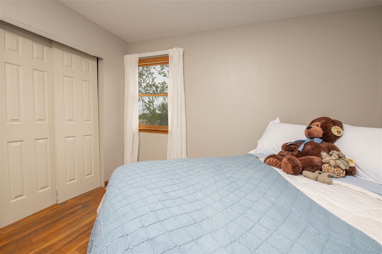 8488 Grange Hall Road Garden Prairie, IL 61038 - Photo 20 of 35 a bedroom with a bed and a window