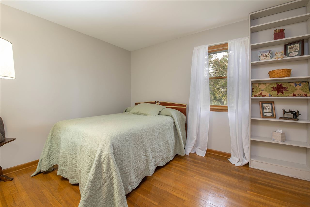 8488 Grange Hall Road Garden Prairie, IL 61038 - Photo 22 of 35 a bedroom with a bed and a window