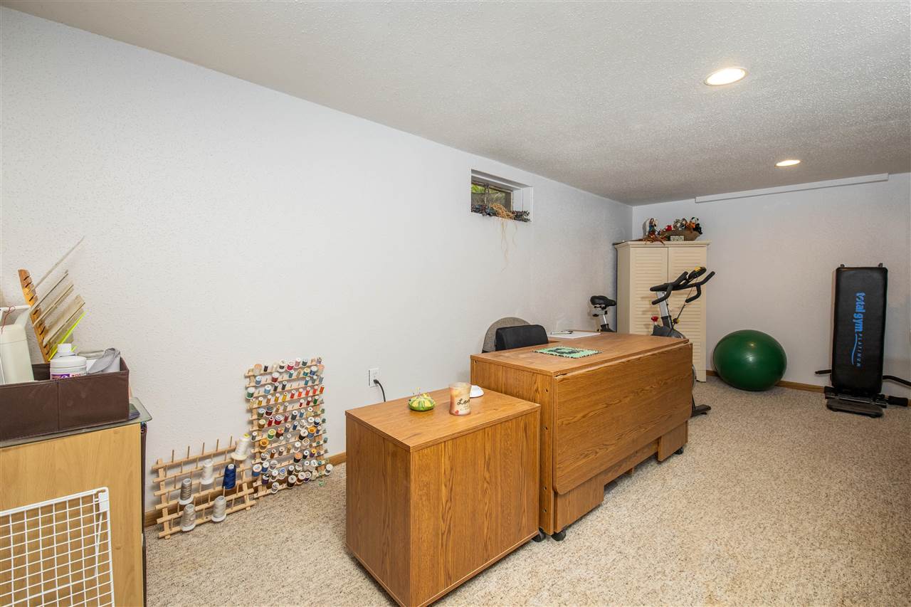 8488 Grange Hall Road Garden Prairie, IL 61038 - Photo 29 of 35 a room with furniture and gym equipment