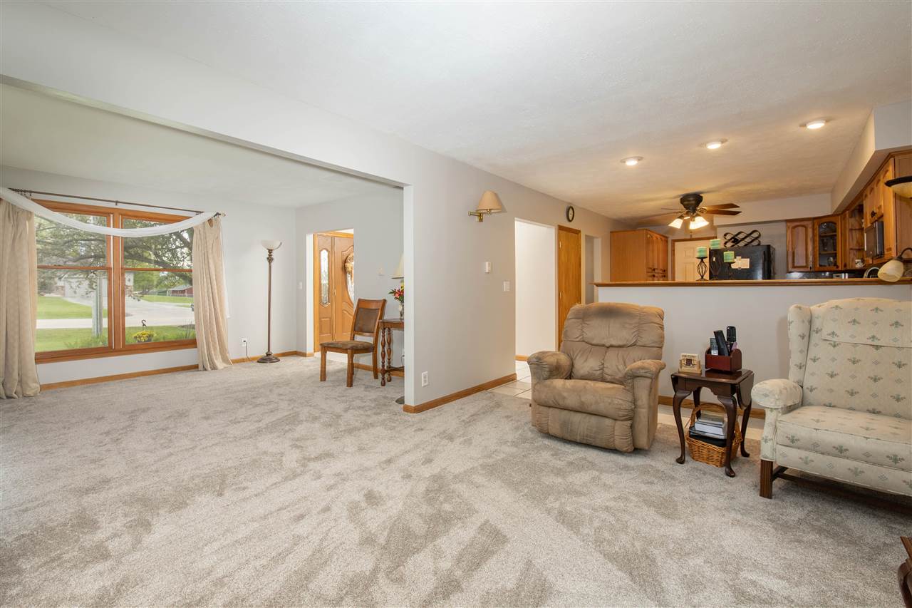 8488 Grange Hall Road Garden Prairie, IL 61038 - Photo 9 of 35 a living room with furniture and a large window
