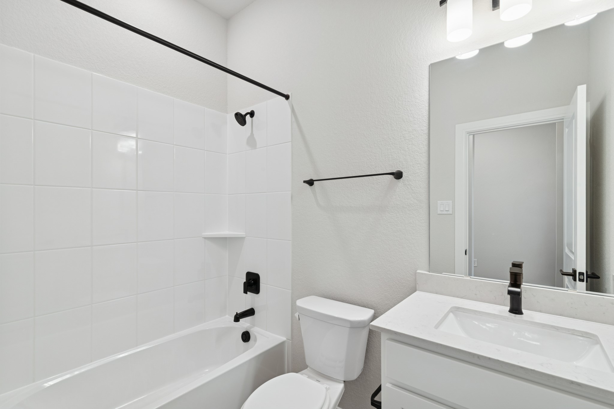 26502 Delightful Drive Hockley, TX 77447 - Photo 14 of 50 a bathroom with a sink toilet and shower