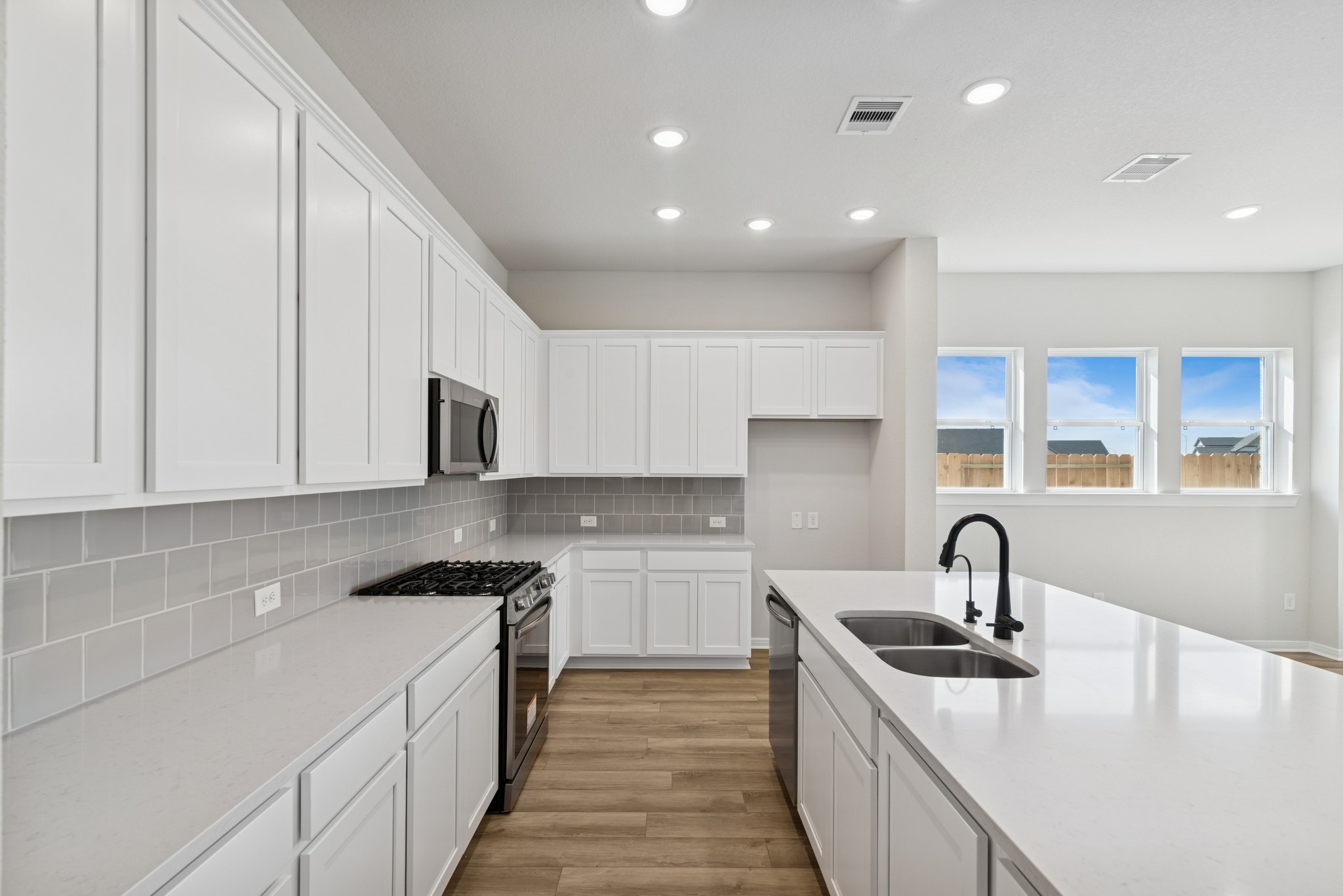 26502 Delightful Drive Hockley, TX 77447 - Photo 18 of 50 a kitchen with a sink and cabinets