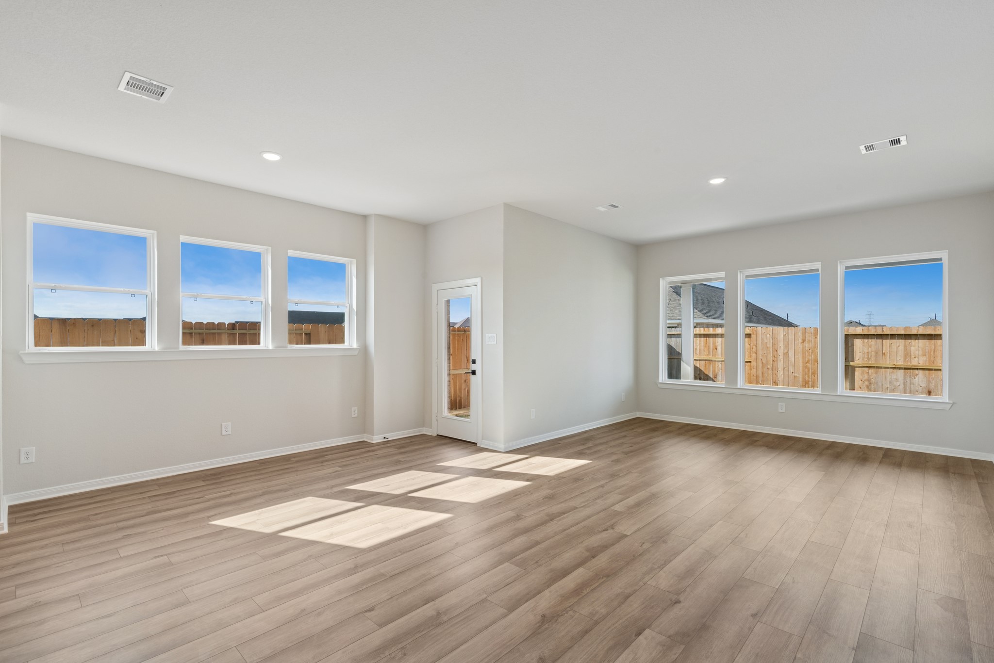 26502 Delightful Drive Hockley, TX 77447 - Photo 21 of 50 a view of an empty room with wooden floor and a window