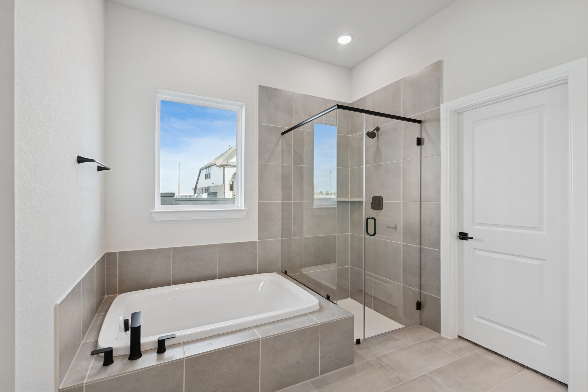 26502 Delightful Drive Hockley, TX 77447 - Photo 27 of 50 a bathroom with a tub a shower and a sink