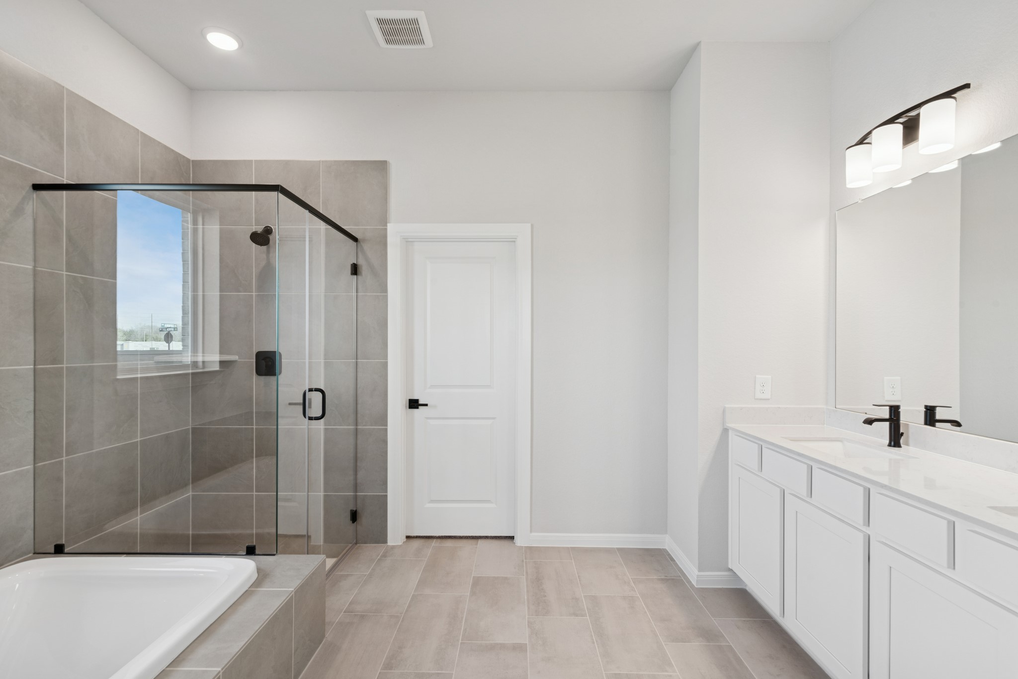 26502 Delightful Drive Hockley, TX 77447 - Photo 28 of 50 a bathroom with a sink a toilet and shower