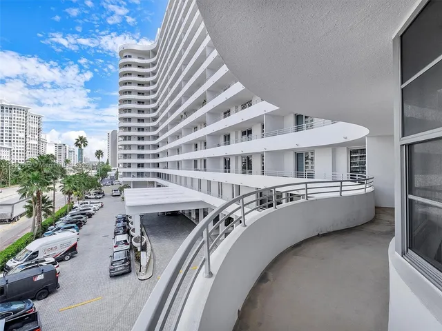 a view of a swimming pool with outdoor seating