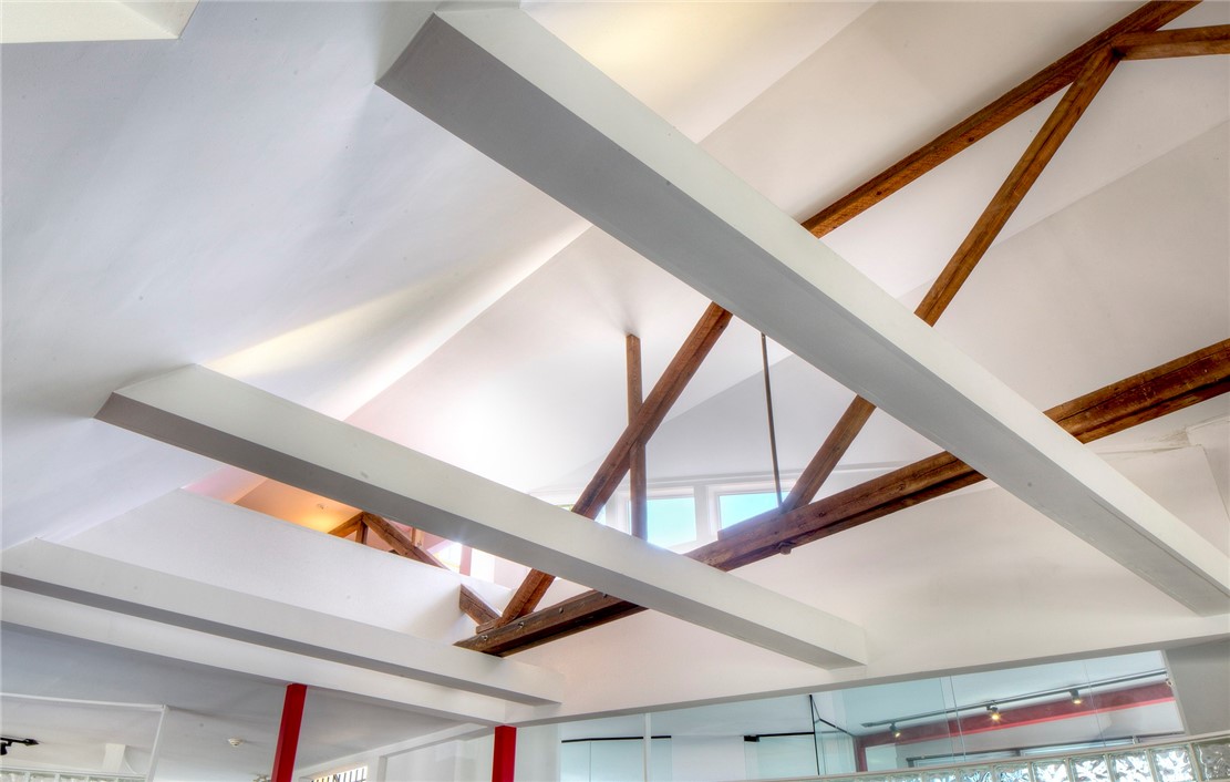 25 Mill Street Newport, RI 02840 - Photo 13 of 46 20+ foot ceilings and a loft space to the left.