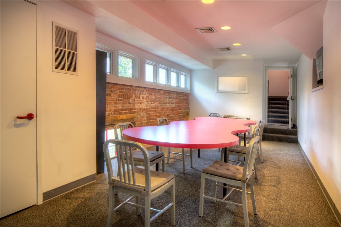 25 Mill Street Newport, RI 02840 - Photo 24 of 46 A few steps down from the second floor office space is a media room.