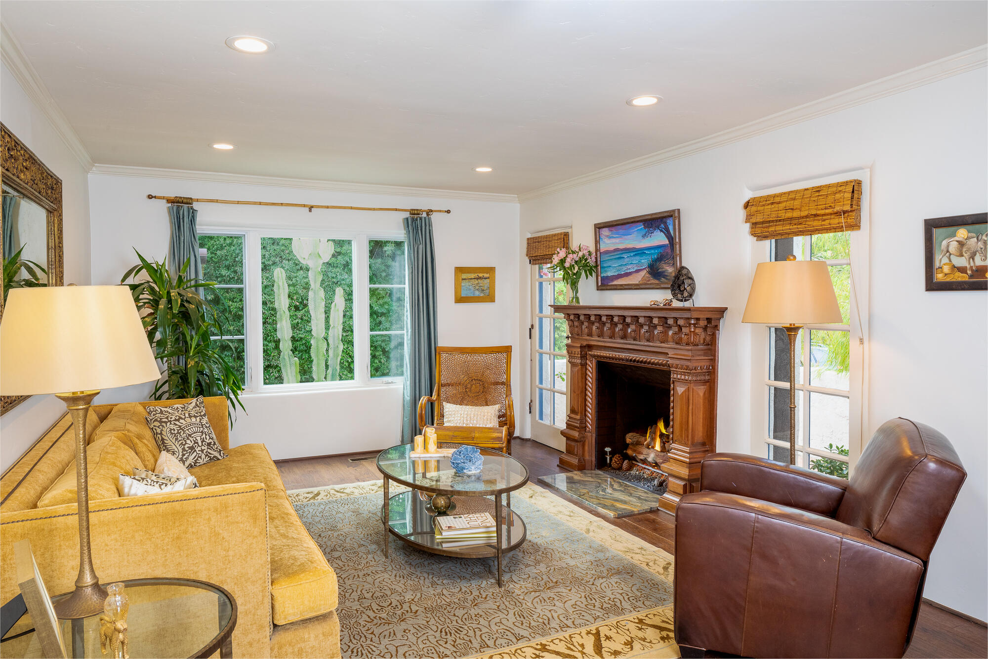 22 Pine Drive Santa Barbara, CA 93105 - Photo 4 of 12 a living room with furniture a fireplace and a large window