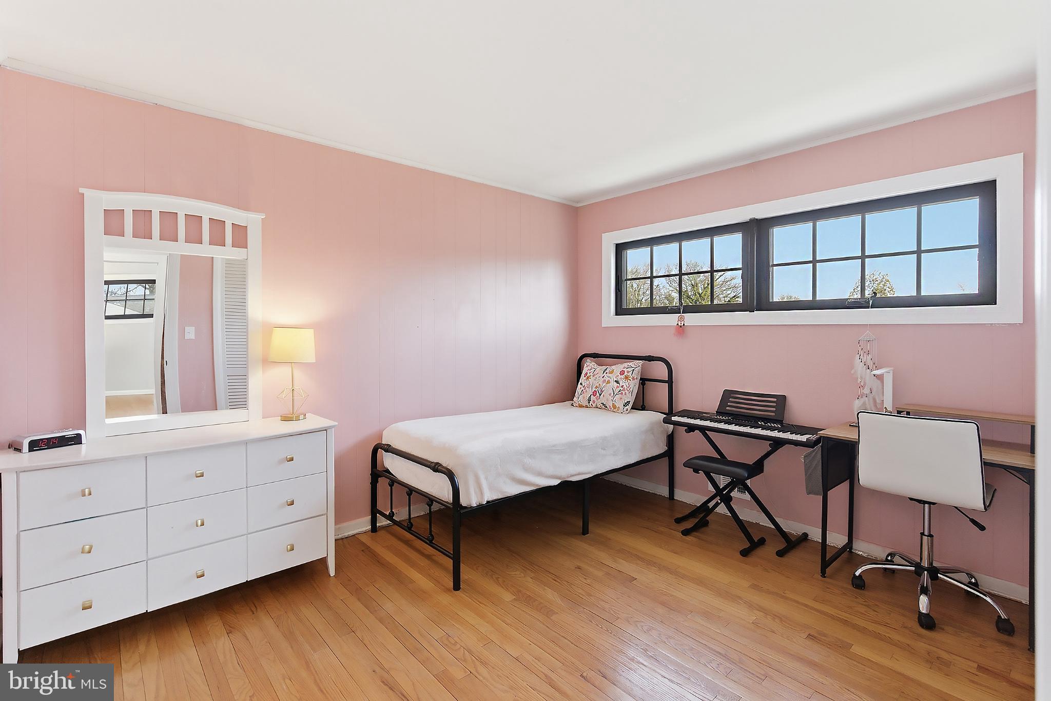 25 Whitman Road Hamilton, NJ 08619 - Photo 17 of 30 Charming pink-hued bedroom with natural light.