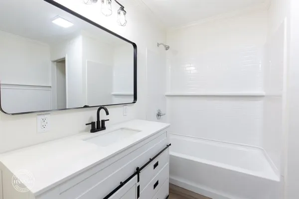 a bathroom with a sink and a bathtub