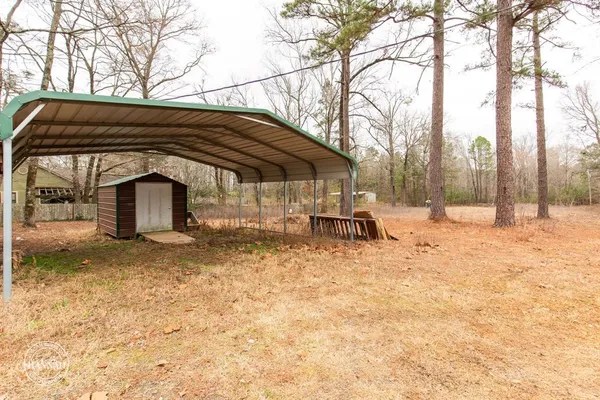a view of patio with a barn