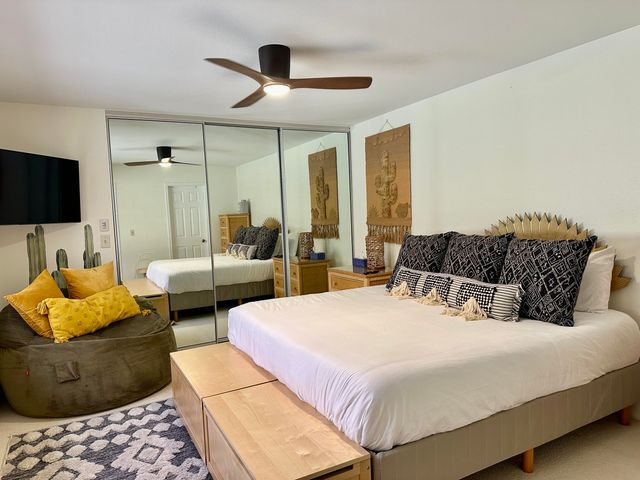 a bedroom with bed and a couch