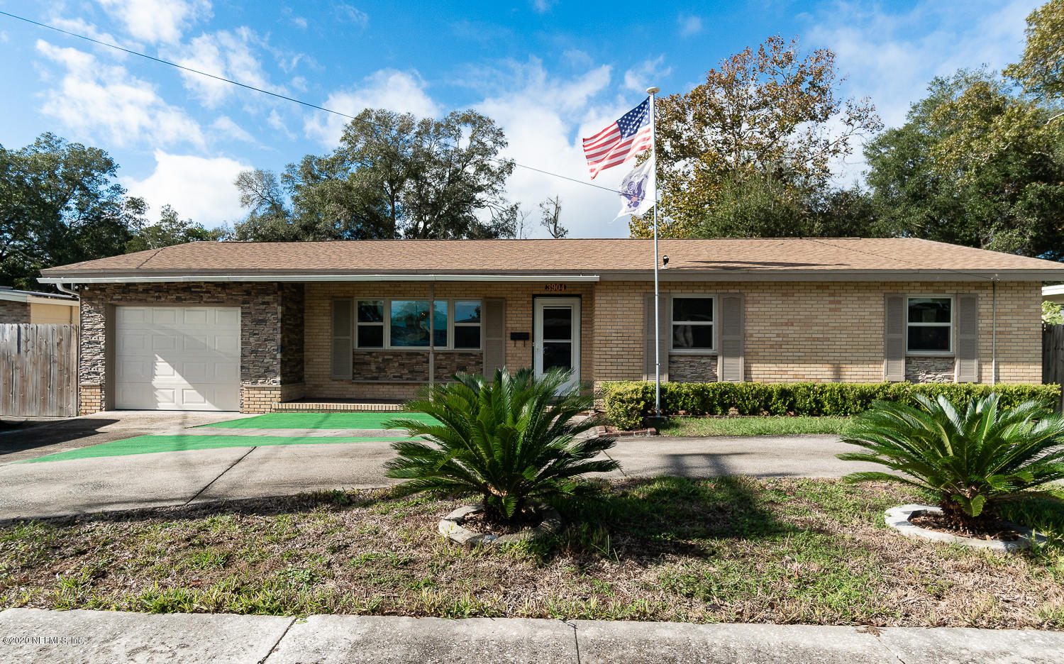 3904 Rogero Road Jacksonville, FL 32277 - Photo 2 of 31 a view of a house with a garden