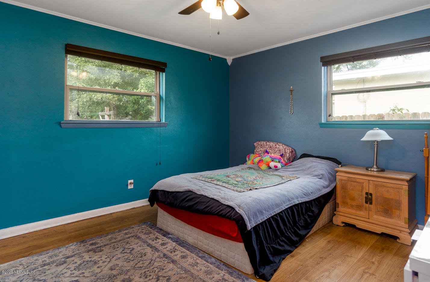 3904 Rogero Road Jacksonville, FL 32277 - Photo 17 of 31 a bedroom with a bed and a window