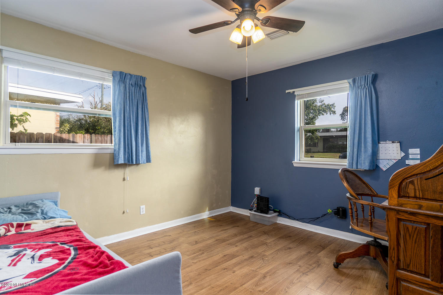 3904 Rogero Road Jacksonville, FL 32277 - Photo 20 of 31 a bedroom with a bed and a window