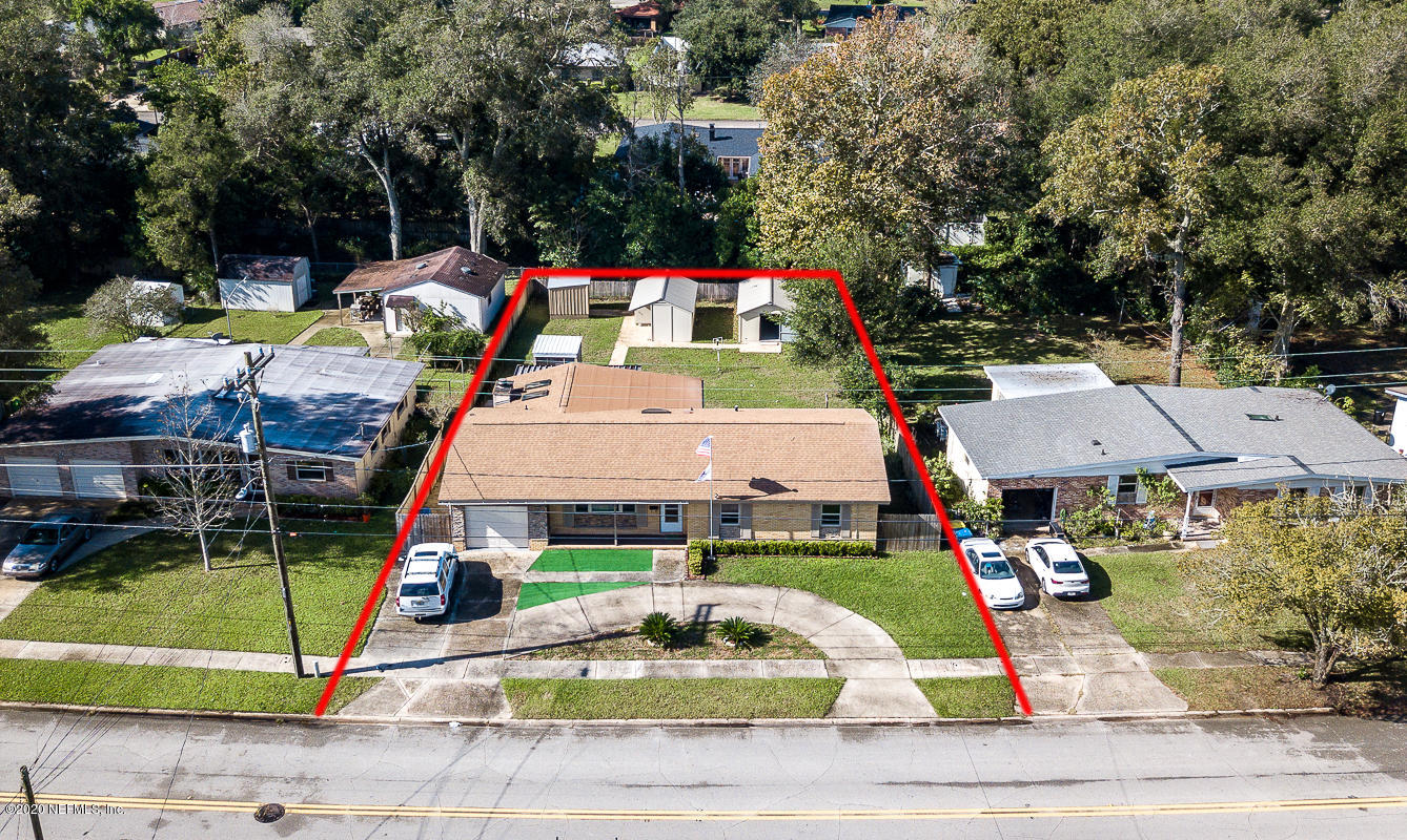 3904 Rogero Road Jacksonville, FL 32277 - Photo 3 of 31 a aerial view of a house with swimming pool and patio