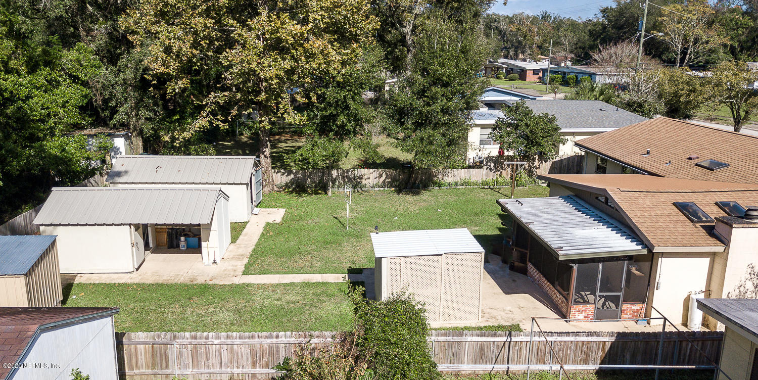 3904 Rogero Road Jacksonville, FL 32277 - Photo 25 of 31 an aerial view of a house with swimming pool garden and patio