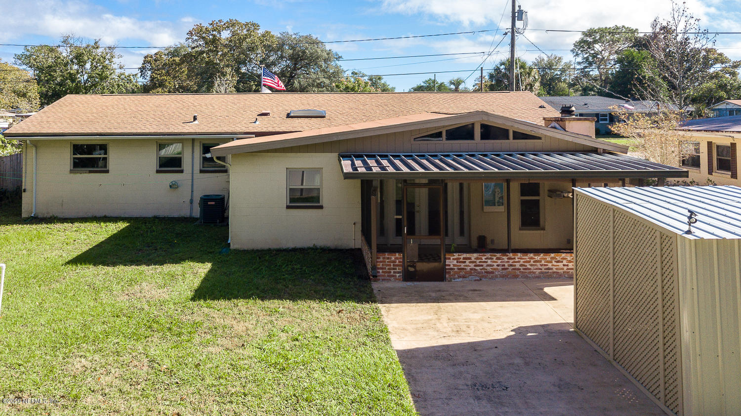 3904 Rogero Road Jacksonville, FL 32277 - Photo 27 of 31 a view of a house with backyard and sitting area