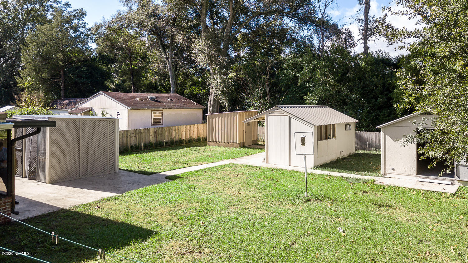 3904 Rogero Road Jacksonville, FL 32277 - Photo 29 of 31 a front view of a house with a yard and garage