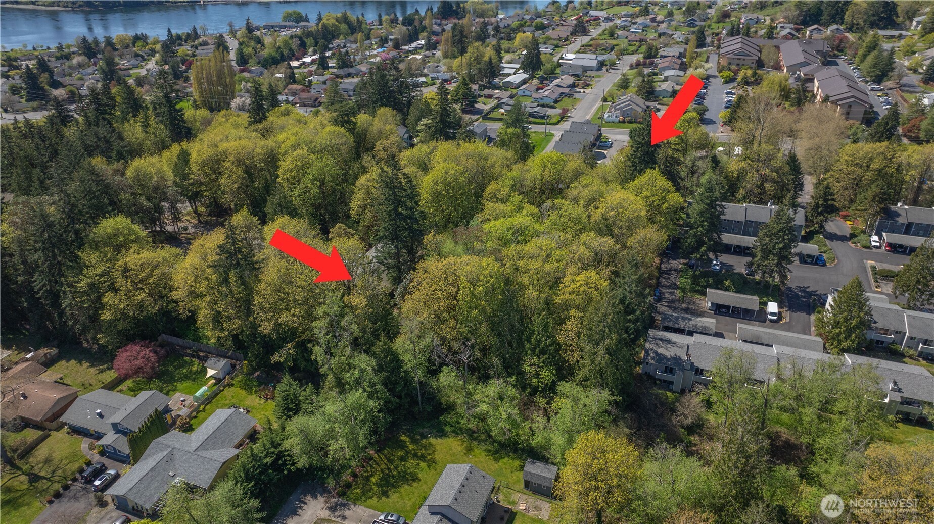 an aerial view of a houses with a yard
