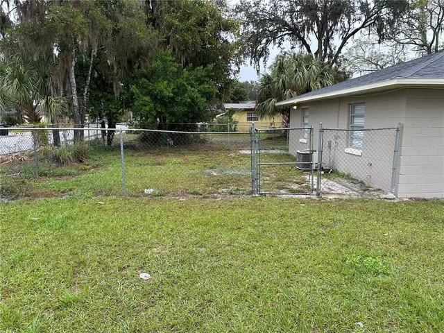 a backyard of a house with lots of green space