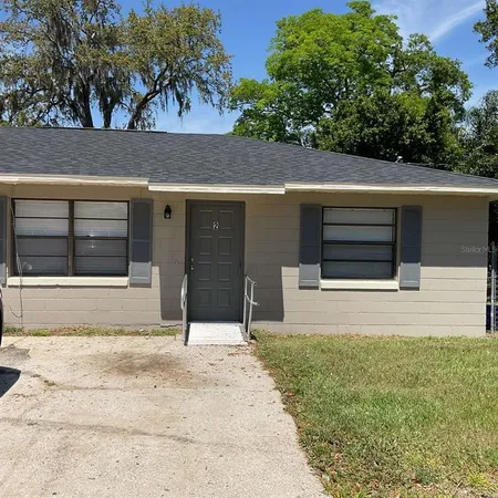 a house with trees in the background