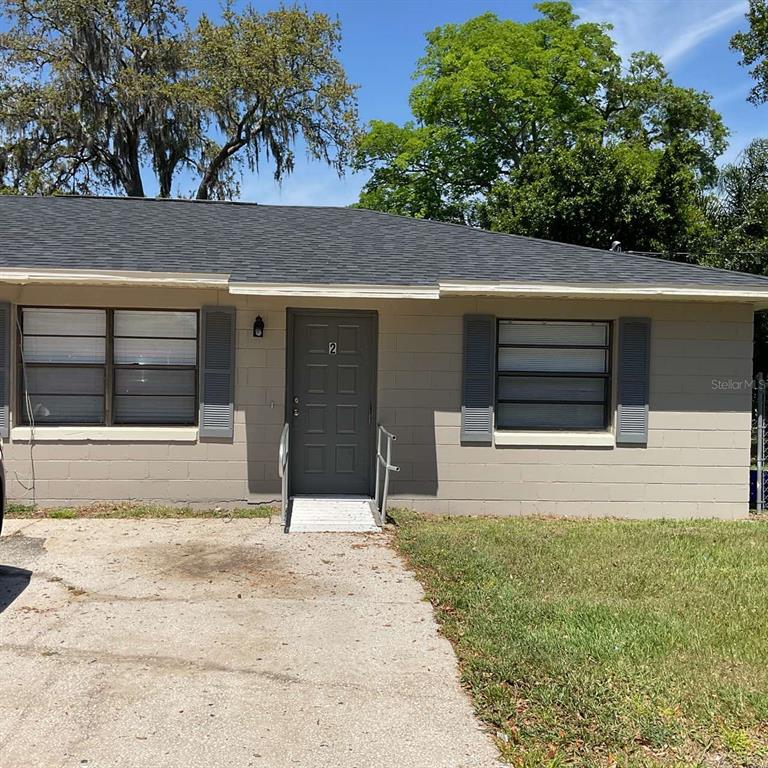 385 Lime Street Maitland, FL 32751 - Photo 3 of 13 a house with trees in the background
