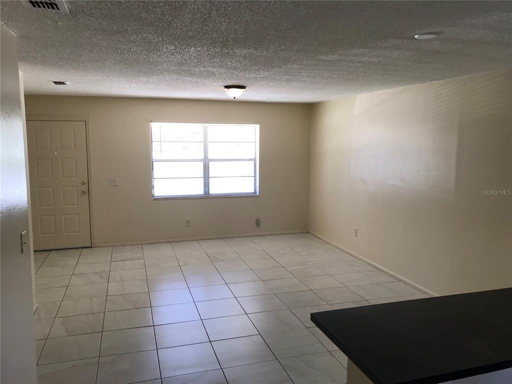 385 Lime Street Maitland, FL 32751 - Photo 5 of 13 a view of an empty room with a window