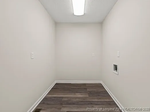 a view of a small space with wooden floor and a window