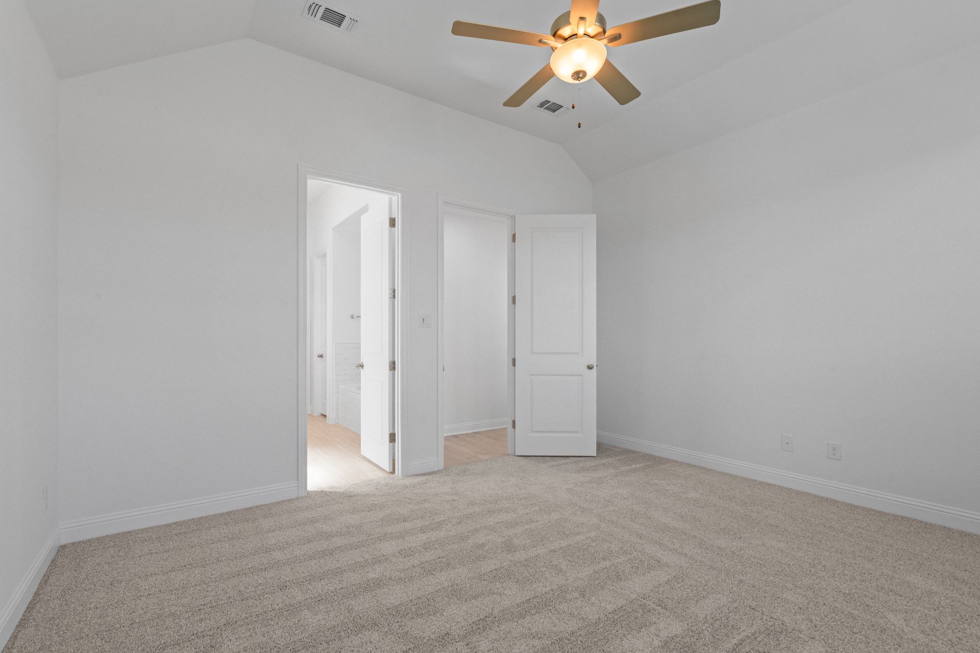 336 Ridgewell Loop Georgetown, TX 78633 - Photo 14 of 31 an empty room with a chandelier fan and a window
