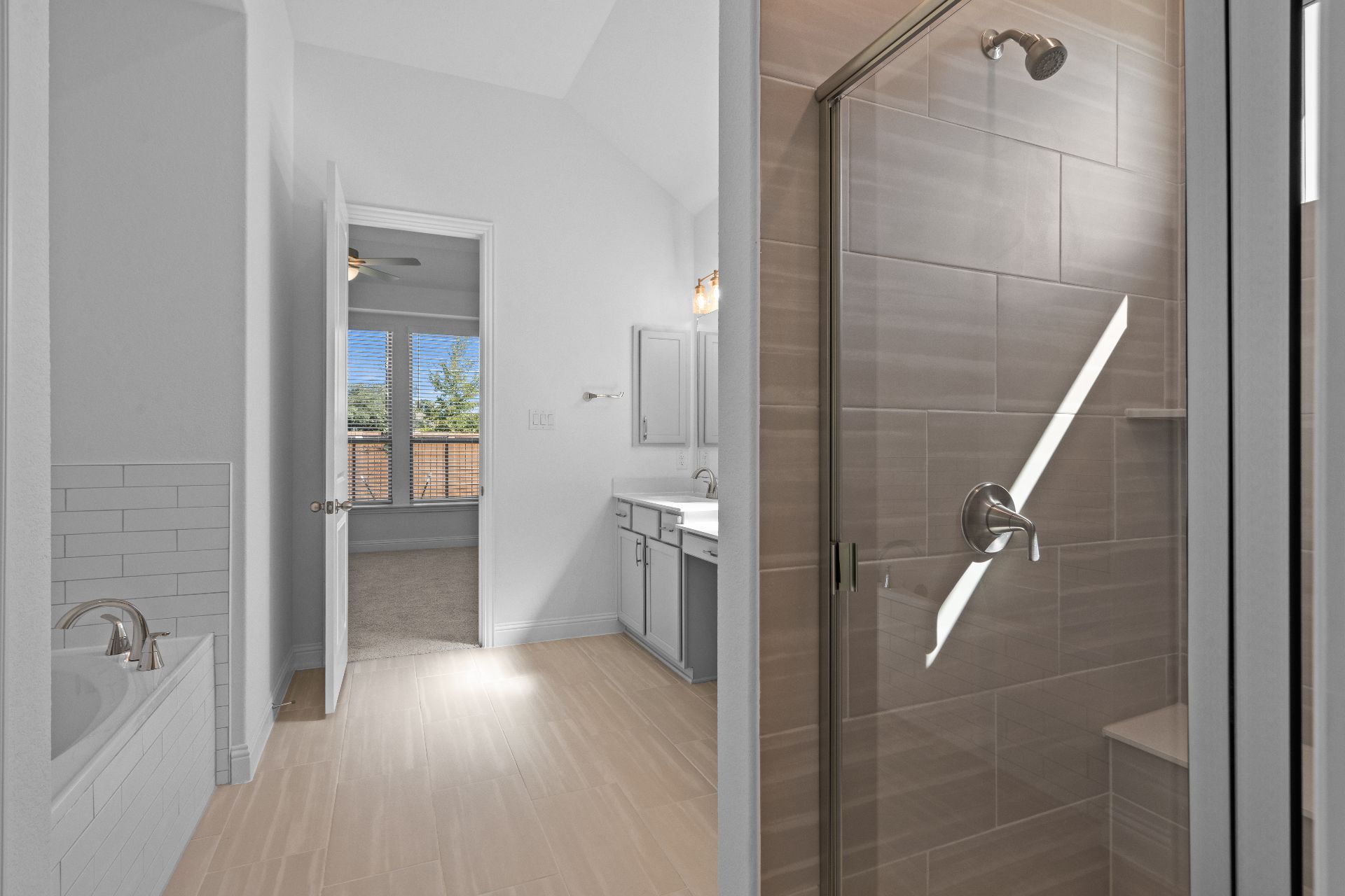 336 Ridgewell Loop Georgetown, TX 78633 - Photo 16 of 31 a bathroom with a bathtub and a shower