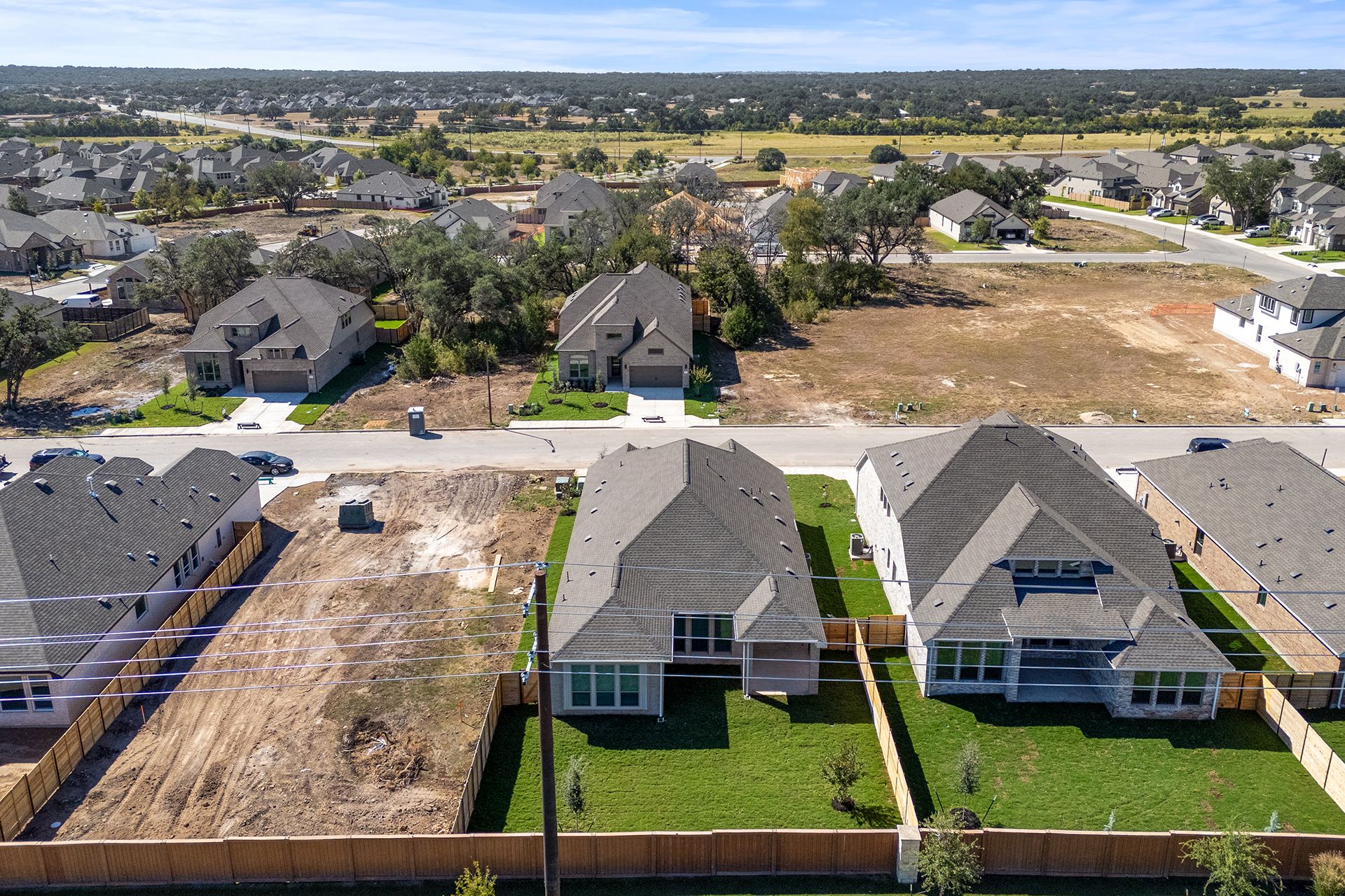 336 Ridgewell Loop Georgetown, TX 78633 - Photo 24 of 31 an aerial view of multiple houses with a big yard