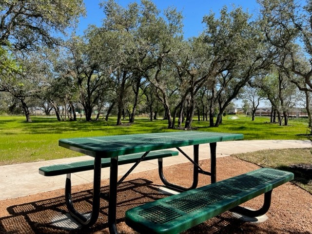 336 Ridgewell Loop Georgetown, TX 78633 - Photo 27 of 31 a view of a bench in a park