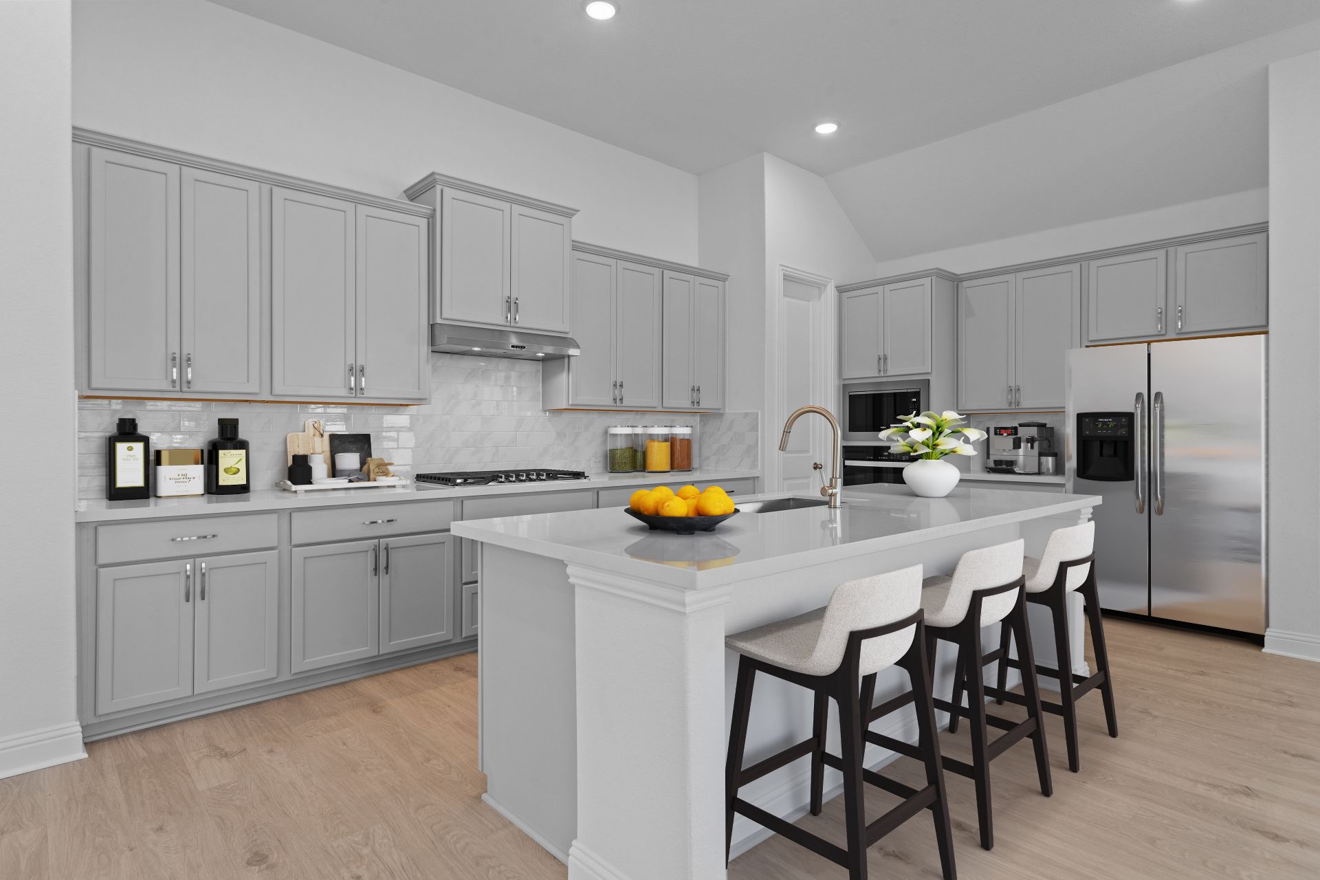 336 Ridgewell Loop Georgetown, TX 78633 - Photo 3 of 31 a kitchen with stainless steel appliances a stove a sink a refrigerator and white cabinets