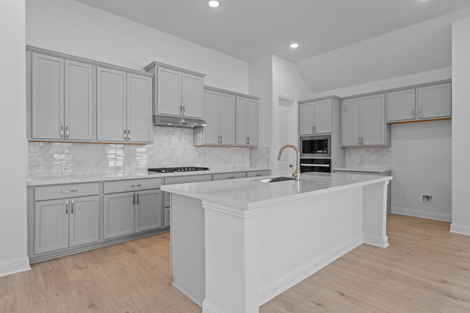 336 Ridgewell Loop Georgetown, TX 78633 - Photo 7 of 31 a kitchen with cabinets appliances a sink and a counter top space