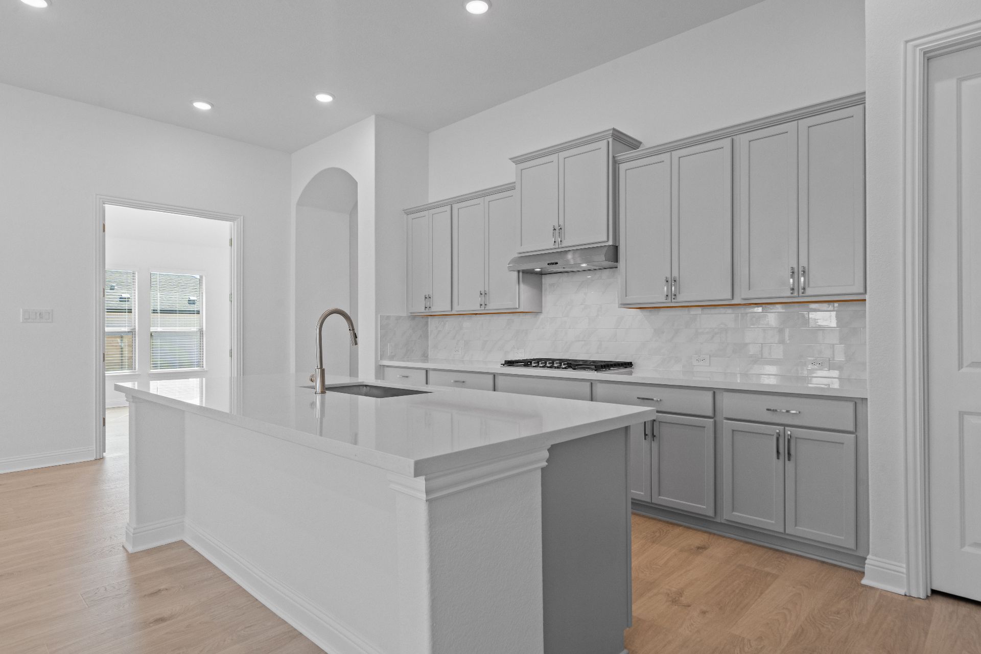 336 Ridgewell Loop Georgetown, TX 78633 - Photo 8 of 31 a kitchen with stainless steel appliances granite countertop a sink a stove and a refrigerator