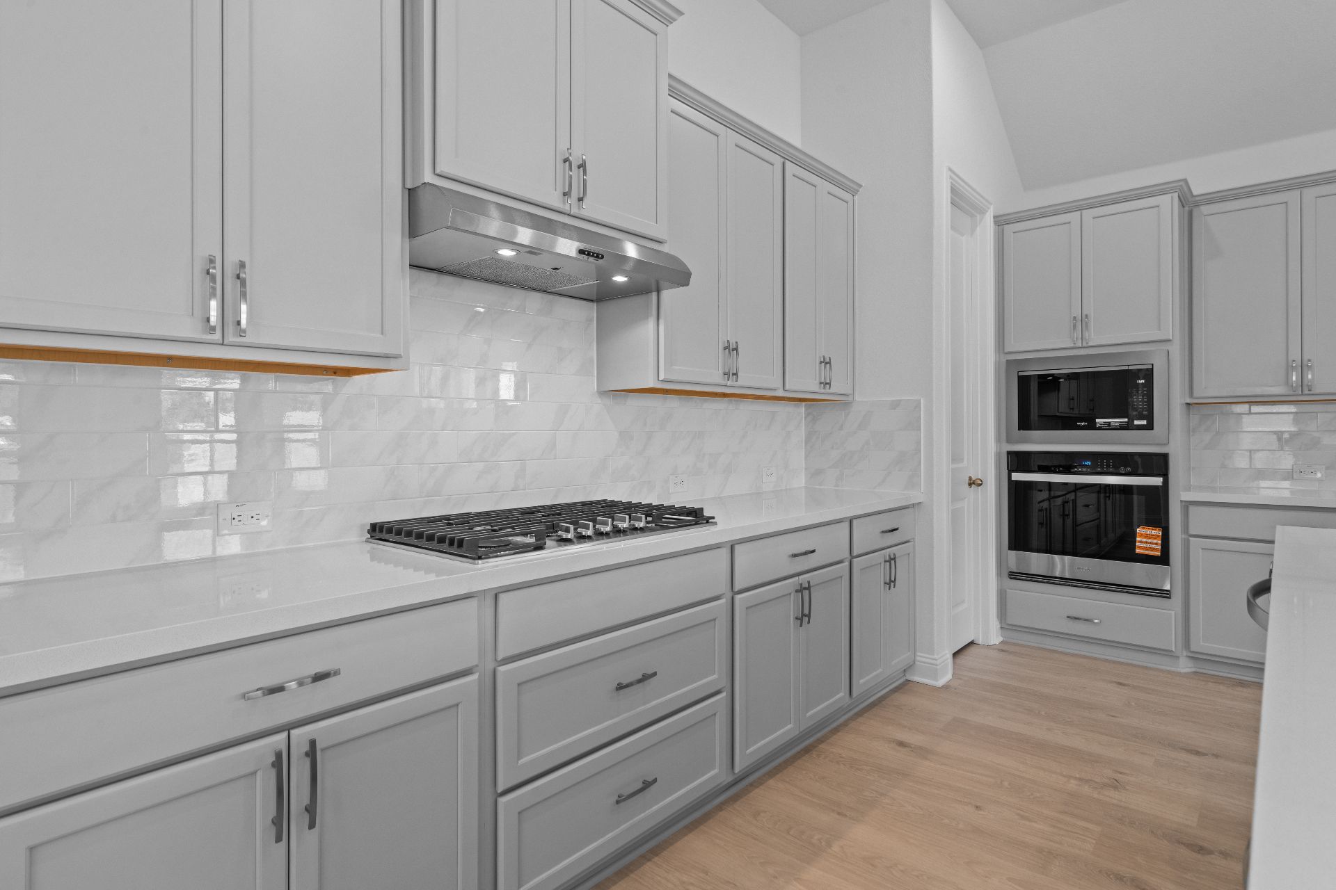 336 Ridgewell Loop Georgetown, TX 78633 - Photo 9 of 31 a kitchen with white cabinets and appliances