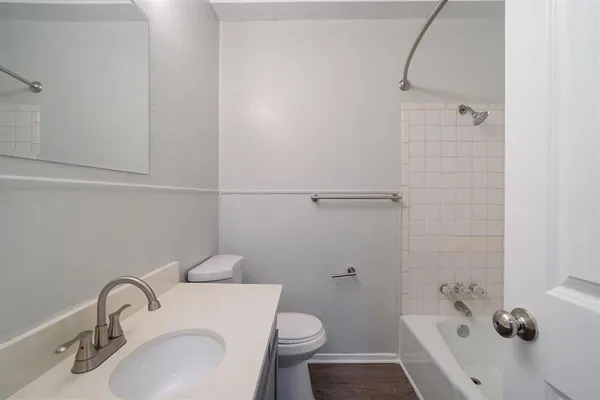 a kitchen with a white cabinets and white appliances