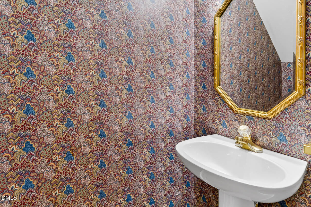 2209 Lodestar Drive Raleigh, NC 27615 - Photo 25 of 50 a bathroom with a sink and a mirror