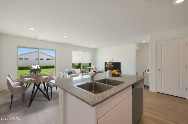 a kitchen with a table chairs and a refrigerator