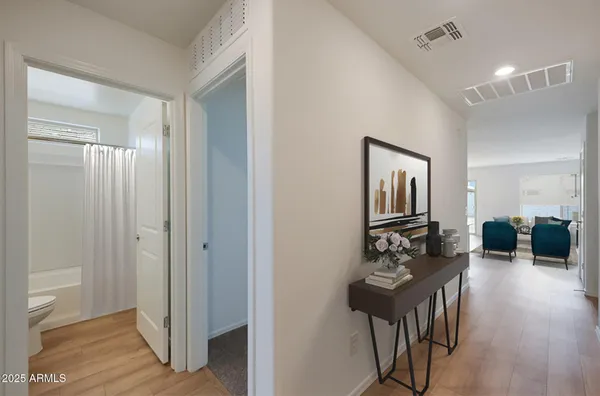 a view of a hallway to a livingroom and furniture