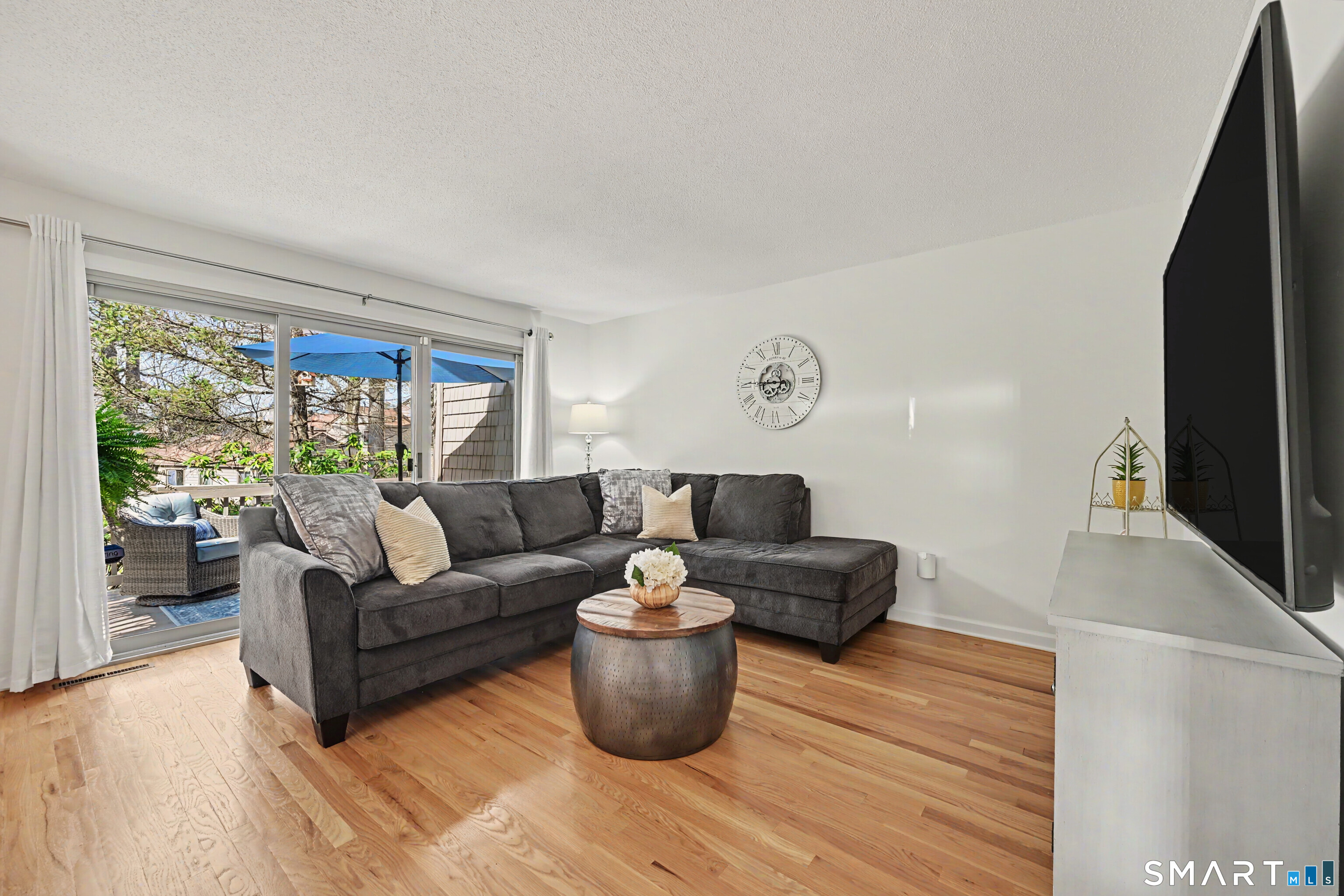42 Powder Mill Road, Unit B Stratford, CT 06614 - Photo 5 of 40 Living Room with view of porch