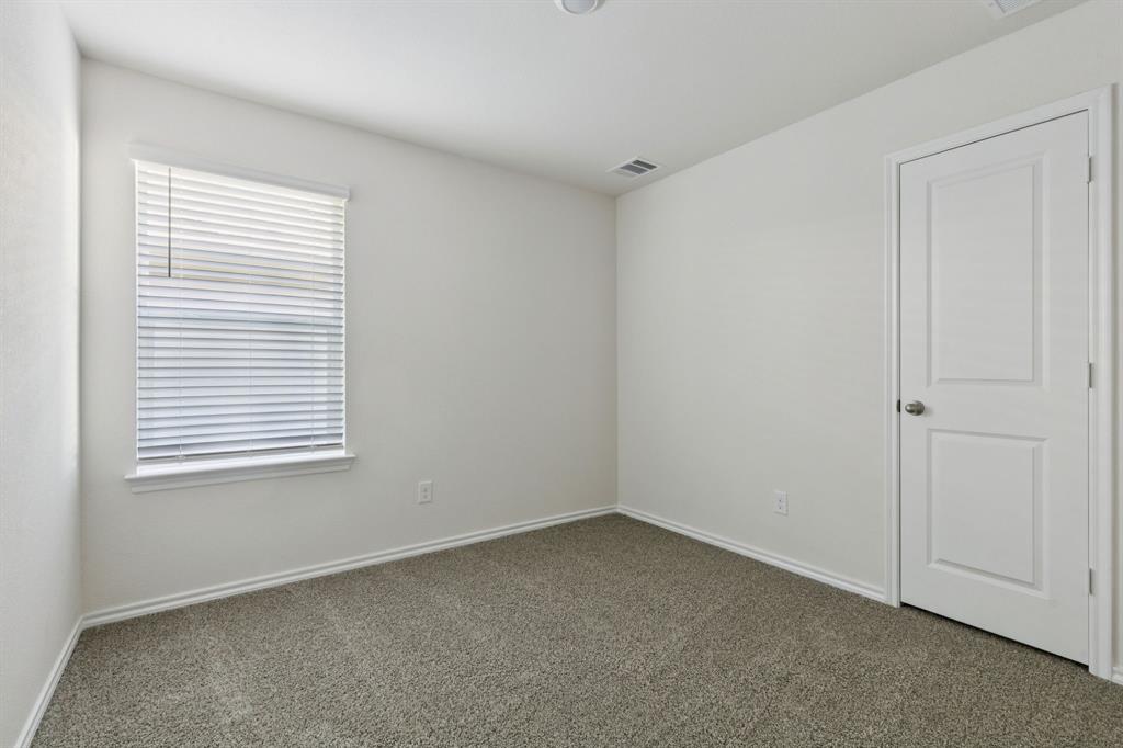 317 Clematis Street Princeton, TX 75407 - Photo 24 of 38 Carpeted spare room featuring baseboards