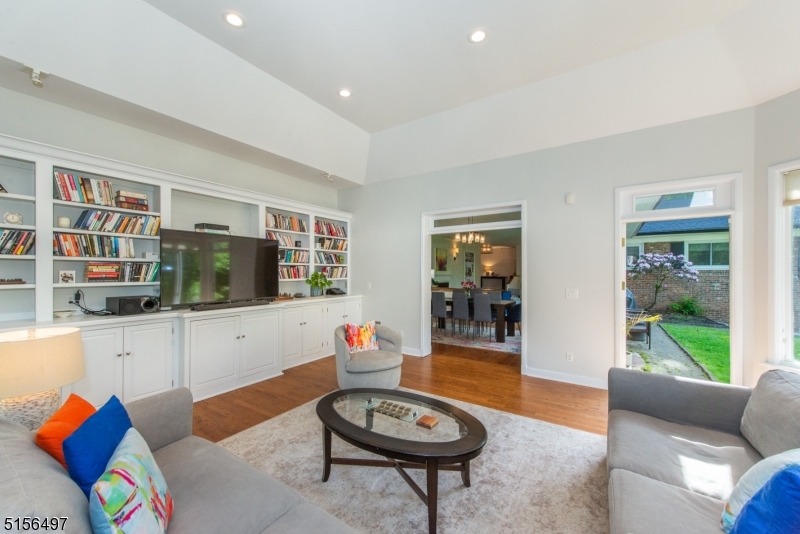 32 Parsonage Hill Road Short Hills, NJ 07078 - Photo 12 of 47 a living room with furniture a flat screen tv and a large window